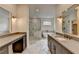 Luxurious bathroom features double sinks, a walk-in shower, and a modern soaking tub at 11305 Knollwood Bend, Johns Creek, GA 30097