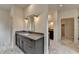 Elegant bathroom featuring double sink vanity with quartz countertop and marble tile flooring at 11305 Knollwood Bend, Johns Creek, GA 30097