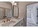 Modern bathroom with double sinks, white countertops, and elegant gold fixtures at 11305 Knollwood Bend, Johns Creek, GA 30097