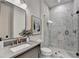 Modern bathroom with marble-tiled walk-in shower, stylish vanity, and frameless glass at 11305 Knollwood Bend, Johns Creek, GA 30097