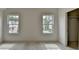 Bright bedroom with two windows offering natural light and closet across the room at 11305 Knollwood Bend, Johns Creek, GA 30097
