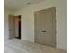 Spacious bedroom featuring neutral carpet, double door closet, and natural lighting at 11305 Knollwood Bend, Johns Creek, GA 30097