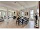 Open dining room featuring a modern chandelier and hardwood flooring at 11305 Knollwood Bend, Johns Creek, GA 30097