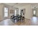 Dining area with hardwood floors, modern chairs, and lots of natural light at 11305 Knollwood Bend, Johns Creek, GA 30097