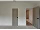 Hallway with gray doors leading to rooms at 11305 Knollwood Bend, Johns Creek, GA 30097