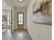 Spacious hallway with hardwood floors and modern art at 11305 Knollwood Bend, Johns Creek, GA 30097