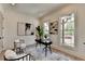 Bright home office with hardwood floors, large windows, and a sleek modern desk and decor at 11305 Knollwood Bend, Johns Creek, GA 30097