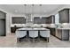 Spacious kitchen featuring a large island with seating, modern appliances and stylish finishes at 11305 Knollwood Bend, Johns Creek, GA 30097