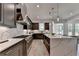 Gourmet kitchen with dark wood cabinetry, stainless steel appliances, and a center island with seating at 11305 Knollwood Bend, Johns Creek, GA 30097