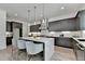 Stunning kitchen with a center island, dark wood cabinetry, and stainless steel appliances at 11305 Knollwood Bend, Johns Creek, GA 30097