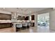 Beautiful kitchen with stainless steel appliances, a center island, and dark cabinets at 11305 Knollwood Bend, Johns Creek, GA 30097