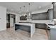 Sleek kitchen features an island, stainless steel appliances, and modern finishes at 11305 Knollwood Bend, Johns Creek, GA 30097