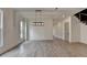 Open living room featuring wood floors and large windows for lots of natural light at 11305 Knollwood Bend, Johns Creek, GA 30097