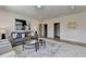 Comfortable living room featuring neutral decor, plush seating, and stylish decorative art at 11305 Knollwood Bend, Johns Creek, GA 30097