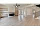 Spacious living room featuring a fireplace, built-in shelves, and open floor plan at 11305 Knollwood Bend, Johns Creek, GA 30097
