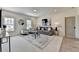 Bright living room with comfortable seating, neutral walls and carpet at 11305 Knollwood Bend, Johns Creek, GA 30097