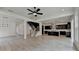 View of living room featuring an open layout with staircase and a modern kitchen at 11305 Knollwood Bend, Johns Creek, GA 30097