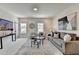 Bright living room with plush seating, a patterned rug, and bright natural light from the windows at 11305 Knollwood Bend, Johns Creek, GA 30097