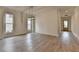 Bright living room showcasing wood floors and large windows for lots of natural light at 11305 Knollwood Bend, Johns Creek, GA 30097