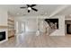 Large living room with fireplace, open floor plan, and stairs at 11305 Knollwood Bend, Johns Creek, GA 30097