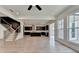 Large living room with an open floor plan to the kitchen and a staircase at 11305 Knollwood Bend, Johns Creek, GA 30097