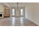 Large living room boasting wood floors, fireplace, and large windows for natural light at 11305 Knollwood Bend, Johns Creek, GA 30097