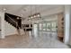 Expansive living area with a modern staircase, wood floors, and an open layout at 11305 Knollwood Bend, Johns Creek, GA 30097