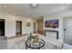 Bright living room showcasing open floor plan and access to the laundry room, and modern fixtures at 11305 Knollwood Bend, Johns Creek, GA 30097