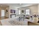 Comfortable living room with neutral decor, large windows, plush seating, and a stylish rug at 11305 Knollwood Bend, Johns Creek, GA 30097