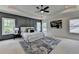 This bedroom boasts a tray ceiling, paneled accent wall, and plush rug at 11305 Knollwood Bend, Johns Creek, GA 30097