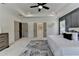 Spacious carpeted bedroom with recessed lights in the trey ceiling, several closets, and an accent wall at 11305 Knollwood Bend, Johns Creek, GA 30097