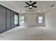 Large main bedroom boasting a ceiling fan, recessed lighting, and plenty of natural light at 11305 Knollwood Bend, Johns Creek, GA 30097