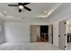 View of main bedroom with door leading to an upstairs hallway, recessed lighting and ceiling fan at 11305 Knollwood Bend, Johns Creek, GA 30097