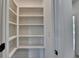 Spacious walk-in pantry with ample shelving, providing organized storage for all your kitchen essentials at 11305 Knollwood Bend, Johns Creek, GA 30097