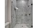 Luxurious bathroom with glass enclosed shower and marble tiles at 11305 Knollwood Bend, Johns Creek, GA 30097