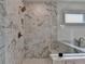 Modern tiled shower with glass enclosure and bronze fixtures at 11305 Knollwood Bend, Johns Creek, GA 30097