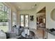 Sitting area with gray chairs, access to a deck and views into another living area at 11305 Knollwood Bend, Johns Creek, GA 30097