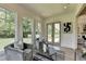 Sitting area with gray chairs, an outdoor deck view and a black and white striped rug at 11305 Knollwood Bend, Johns Creek, GA 30097