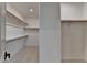 A well-organized walk-in closet with carpet and ample shelf space creates plenty of room for storage in the main bedroom at 11305 Knollwood Bend, Johns Creek, GA 30097