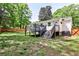 Backyard with a deck, patio, and stairs leading down to a grassy area at 2195 Penelope Nw St, Atlanta, GA 30314