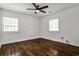 Empty bedroom featuring hardwood floors, natural light from two windows, and neutral walls at 2195 Penelope Nw St, Atlanta, GA 30314