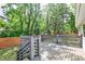 Wood deck with gray railings overlooking a yard and partial privacy fence at 2195 Penelope Nw St, Atlanta, GA 30314