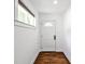 Bright entryway featuring hardwood floors and a white front door with window at 2195 Penelope Nw St, Atlanta, GA 30314