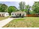 Charming home with mature landscaping, a welcoming porch, and a cozy exterior at 2195 Penelope Nw St, Atlanta, GA 30314