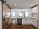 Modern kitchen with white cabinets, stainless appliances, and a charming barn door entrance at 2195 Penelope Nw St, Atlanta, GA 30314