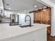 Bright kitchen featuring white cabinetry, quartz countertops, stainless appliances, and a barn door at 2195 Penelope Nw St, Atlanta, GA 30314