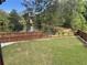 Large fenced backyard with a pond view, perfect for outdoor activities at 292 Aylesbury Bv, Mcdonough, GA 30252