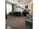 Cozy living room featuring a bar, stools, comfortable seating and an aquarium in the corner at 292 Aylesbury Bv, Mcdonough, GA 30252