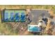 Aerial view showcases the community pool, tennis courts, clubhouse, and parking area surrounded by lush trees at 1025 Ector Nw Dr, Kennesaw, GA 30152