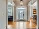 Elegant foyer with hardwood floors, decorative molding, and a glass-paneled door leading to other rooms at 1025 Ector Nw Dr, Kennesaw, GA 30152